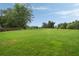 Expansive backyard with lush green grass, perfect for outdoor activities and relaxation at 4188 Kindlewood Ne Ct, Roswell, GA 30075