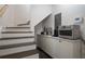 Finished basement with under stair storage and utility space at 4188 Kindlewood Ne Ct, Roswell, GA 30075