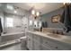 Bathroom featuring double sinks, modern fixtures and a glass enclosed shower and tub at 4188 Kindlewood Ne Ct, Roswell, GA 30075