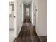 A hallway shows wood floors and leads to various rooms including a bathroom at 4188 Kindlewood Ne Ct, Roswell, GA 30075