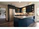 Modern kitchen with navy cabinets, granite counters, and stainless steel appliances at 4188 Kindlewood Ne Ct, Roswell, GA 30075