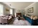 Spacious living room featuring a piano, comfortable seating and natural light at 4188 Kindlewood Ne Ct, Roswell, GA 30075