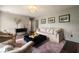 Cozy living room with traditional decor, plush seating, and soft lighting at 4188 Kindlewood Ne Ct, Roswell, GA 30075
