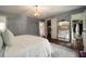 Comfortable primary bedroom with decorative rug, closet and ensuite bathroom at 4188 Kindlewood Ne Ct, Roswell, GA 30075