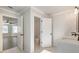 Bright bathroom with marble floors, double vanity, and separate toilet room at 4436 Hosch Reserve Ct, Buford, GA 30519