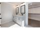 Bathroom featuring double vanity and access to walk-in closet at 4436 Hosch Reserve Ct, Buford, GA 30519