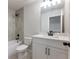 Bright bathroom featuring modern fixtures, gray tile and a tub and shower at 4436 Hosch Reserve Ct, Buford, GA 30519