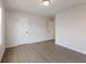 Neutral bedroom with two entry doors, offering flexible use for guests or Gathering at 4436 Hosch Reserve Ct, Buford, GA 30519