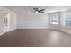 Primary bedroom with ceiling fan, access to bathroom and natural light at 4436 Hosch Reserve Ct, Buford, GA 30519