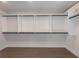 Spacious walk-in closet with custom shelving and ample storage space at 4436 Hosch Reserve Ct, Buford, GA 30519