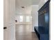 Inviting entryway with a stylish coat rack and bench, leading into a bright living space at 4436 Hosch Reserve Ct, Buford, GA 30519
