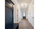 Hallway with dark blue wood accent wall and built in bench at 4436 Hosch Reserve Ct, Buford, GA 30519