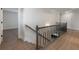 Upstairs hallway featuring wooden banister at 4436 Hosch Reserve Ct, Buford, GA 30519