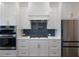 Modern kitchen featuring stainless steel appliances, double oven, and gas cooktop at 4436 Hosch Reserve Ct, Buford, GA 30519