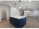 Kitchen featuring a navy island, white countertops, stainless appliances, and wood flooring at 4436 Hosch Reserve Ct, Buford, GA 30519