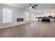 Bright living room with a modern fireplace and an open floor plan connected to the kitchen at 4436 Hosch Reserve Ct, Buford, GA 30519