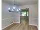 Dining room featuring new flooring and fixture with views of the outside at 1102 Tony Valley Dr, Conyers, GA 30013