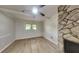 Living space boasts a striking stone fireplace and abundant natural light at 1102 Tony Valley Dr, Conyers, GA 30013