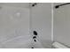 Clean and modern shower with white tiled walls and modern fixtures in neutral tones at 1102 Tony Valley Dr, Conyers, GA 30013