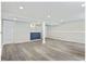 Finished basement features laminate flooring, a supporting column, and a stylish wet bar at 2106 Singer Way, Lithonia, GA 30058