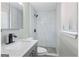 Modern bathroom with a marble tiled shower, updated vanity and fixtures at 2106 Singer Way, Lithonia, GA 30058