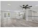 Spacious living room with hardwood floors that connect to a modern kitchen at 2106 Singer Way, Lithonia, GA 30058
