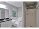 Bathroom with granite countertop, bathtub, and a separate shower at 2428 Harmony Ridge Ct, Lithonia, GA 30058