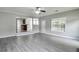 Open-concept living room featuring seamless hardwood floors and an open view into the kitchen area at 2428 Harmony Ridge Ct, Lithonia, GA 30058