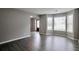 Bright living room featuring large windows and modern flooring at 2428 Harmony Ridge Ct, Lithonia, GA 30058