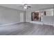 This large living room features an open-concept floor plan and a kitchen area at 2428 Harmony Ridge Ct, Lithonia, GA 30058