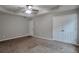 The main bedroom features neutral walls, carpet floors, and multiple closets at 2428 Harmony Ridge Ct, Lithonia, GA 30058