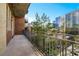 Spacious balcony providing city views, adorned with brick accents and a sleek railing at 3180 Mathieson Drive # 703, Atlanta, GA 30305