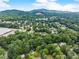 Scenic aerial view of the neighborhood with lush trees, homes, and rolling hills in the distance at 4990 Turtle Rock Drive Dr, Marietta, GA 30066