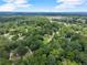 Overhead shot of the home in a wooded neighborhood with mature trees, offering a sense of privacy at 4990 Turtle Rock Drive Dr, Marietta, GA 30066