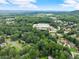 Aerial view of neighborhood with homes surrounded by lush trees, offering a serene environment at 4990 Turtle Rock Drive Dr, Marietta, GA 30066