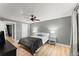 This bedroom features a ceiling fan, grey walls, hardwood floors, and white trim at 4990 Turtle Rock Drive Dr, Marietta, GA 30066