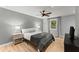 Bright bedroom with hardwood floors, ceiling fan, and natural light from the window at 4990 Turtle Rock Drive Dr, Marietta, GA 30066