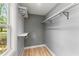 A small walk-in closet with white shelving and wood floors at 4990 Turtle Rock Drive Dr, Marietta, GA 30066