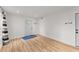 Clean entryway with white walls, wood floor, and a modern door at 4990 Turtle Rock Drive Dr, Marietta, GA 30066