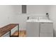 Clean, bright laundry room with white appliances and wood floors at 4990 Turtle Rock Drive Dr, Marietta, GA 30066