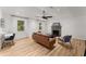 Bright living room with wood floors, a fireplace, and a ceiling fan, creating a cozy atmosphere at 4990 Turtle Rock Drive Dr, Marietta, GA 30066