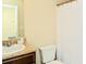 Bathroom featuring a sink, dark cabinetry, and a shower with tub at 2010 Shortleaf Rd, Fairburn, GA 30213