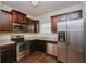 Well-equipped kitchen with stainless steel appliances, dark cabinetry, and laminate countertops at 2010 Shortleaf Rd, Fairburn, GA 30213