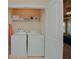 Laundry room features a washer, dryer and shelving at 2010 Shortleaf Rd, Fairburn, GA 30213