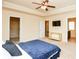 Spacious bedroom features a tray ceiling, a ceiling fan, and a TV at 2010 Shortleaf Rd, Fairburn, GA 30213