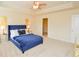 Spacious bedroom features a tray ceiling, a ceiling fan, and an ensuite bath at 2010 Shortleaf Rd, Fairburn, GA 30213
