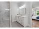 Modern bathroom with a glass-enclosed shower, white vanity, and stylish tile flooring at 4445 Pebble Rock Dr, Cumming, GA 30041
