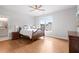 Comfortable bedroom featuring hardwood floors, natural light, and neutral color palette at 4445 Pebble Rock Dr, Cumming, GA 30041