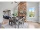 Elegant dining room with stone fireplace and ample seating, perfect for entertaining at 4445 Pebble Rock Dr, Cumming, GA 30041