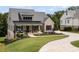 Charming home with a welcoming front porch and manicured landscaping, set on a well-maintained lawn at 4445 Pebble Rock Dr, Cumming, GA 30041